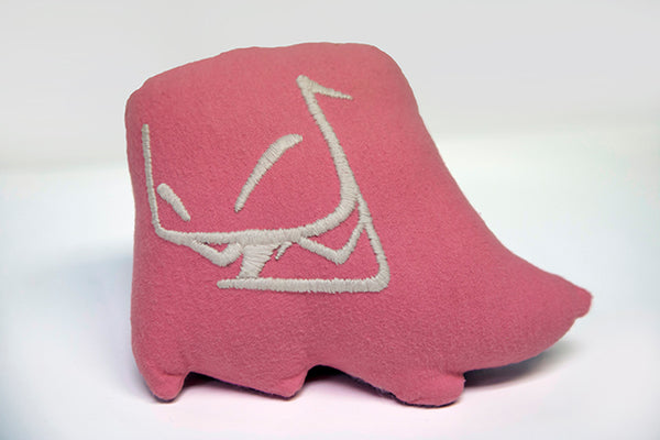 Hand sewn small pink Mr. Fangs plush with hand-embroidered smile in white.