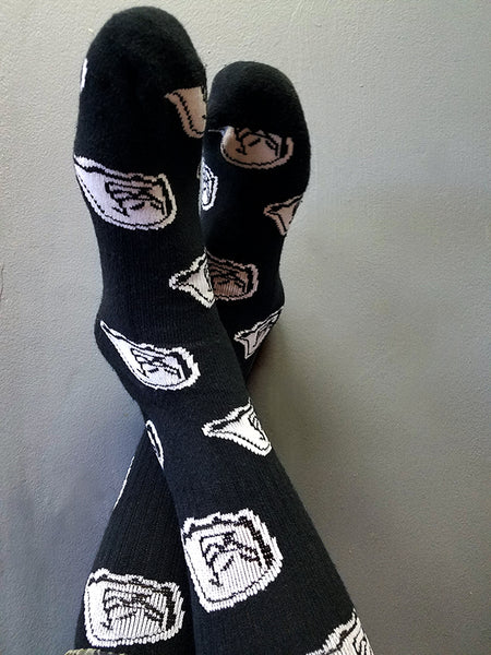 Men's 9-12 mid-calf black and white original Mr. Fangs ghost socks with chicken leg on the sole.