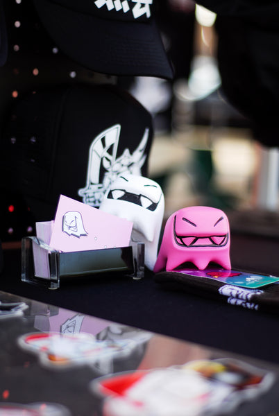white and pink Mr. Fangs acrylic toy figurines