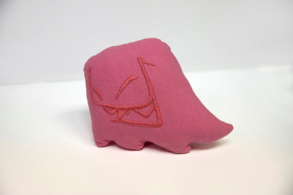 Hand sewn small pink Mr. Fangs plush with hand-embroidered smile in pink.